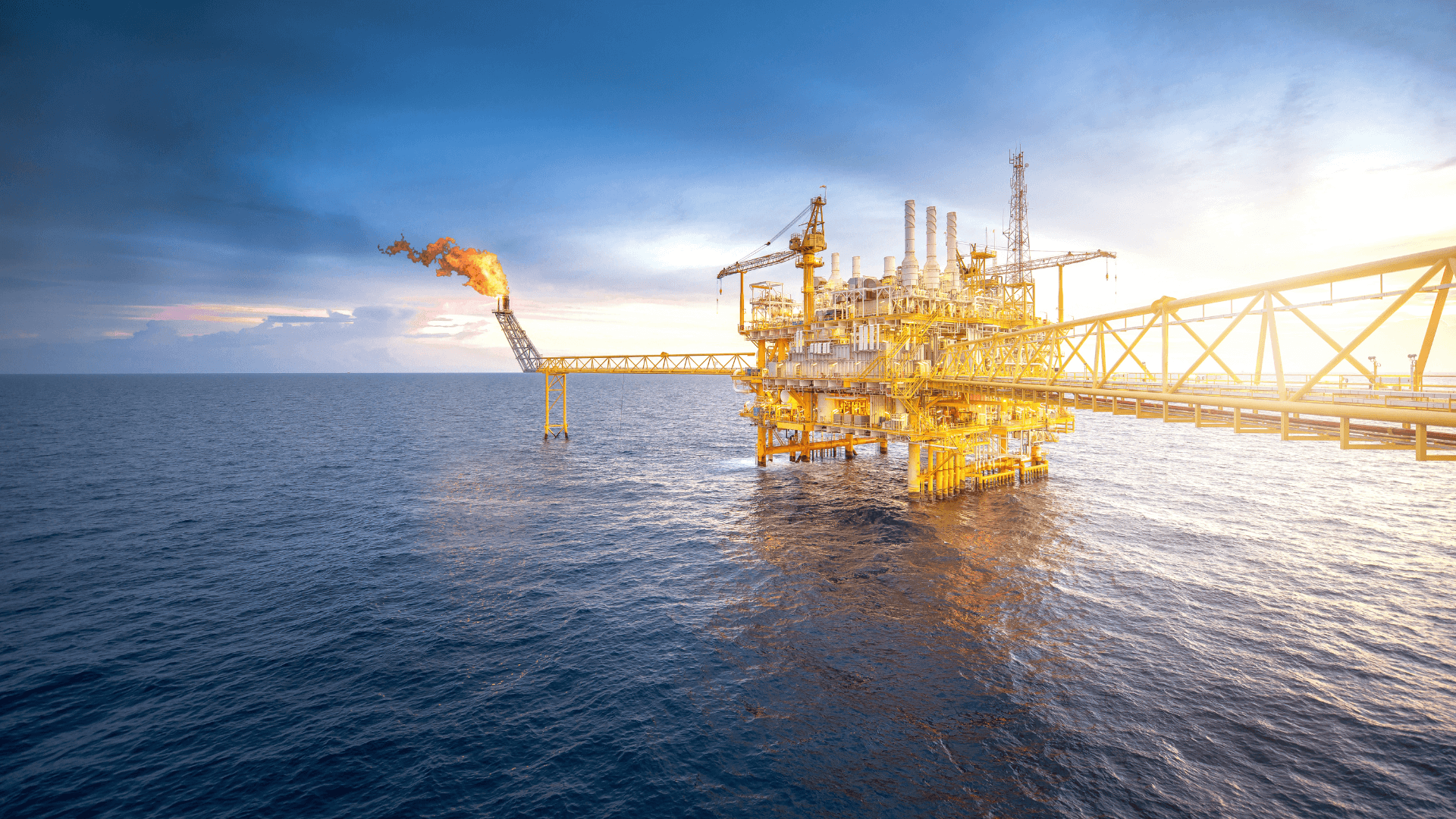 A large oil rig that is set in a large body of water. (1)